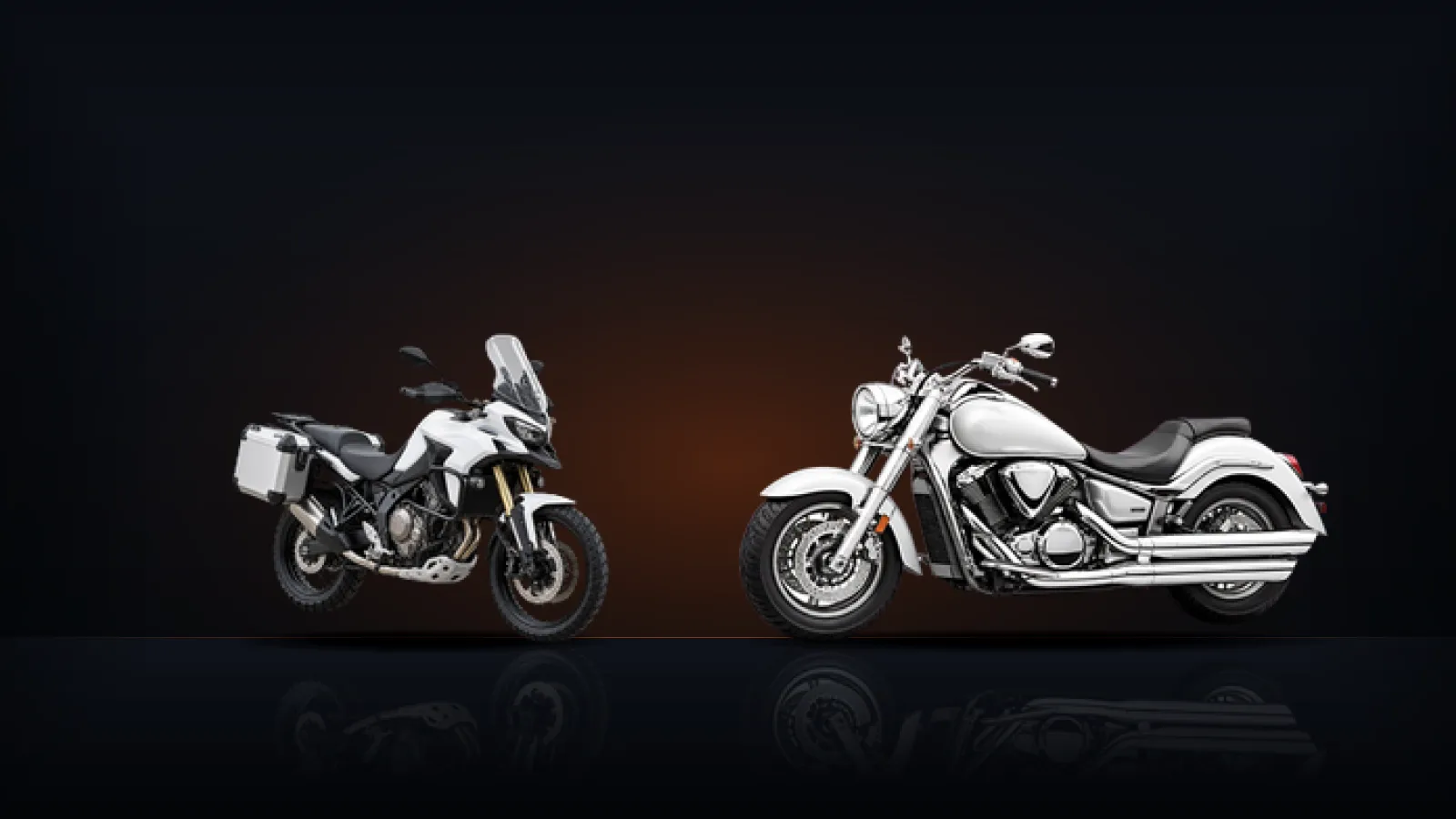 An adventure touring motorcycle with luggage cases beside a cruiser motorcycle